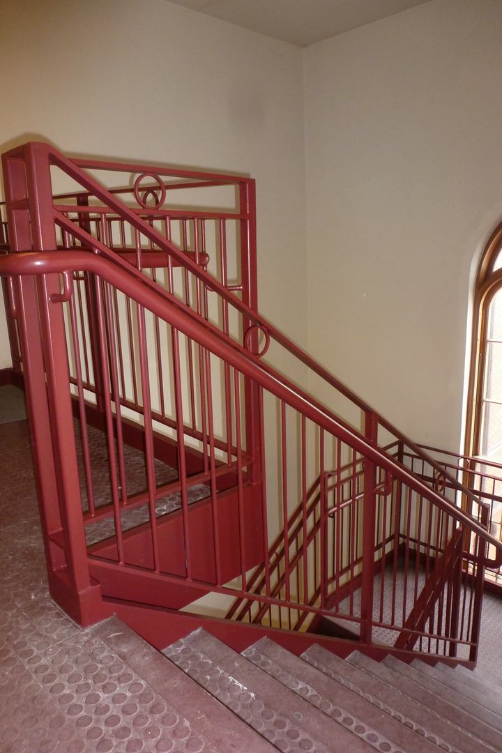 Red railing at the corner for stair
