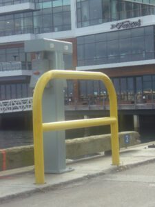 Yellow holding railing at dock